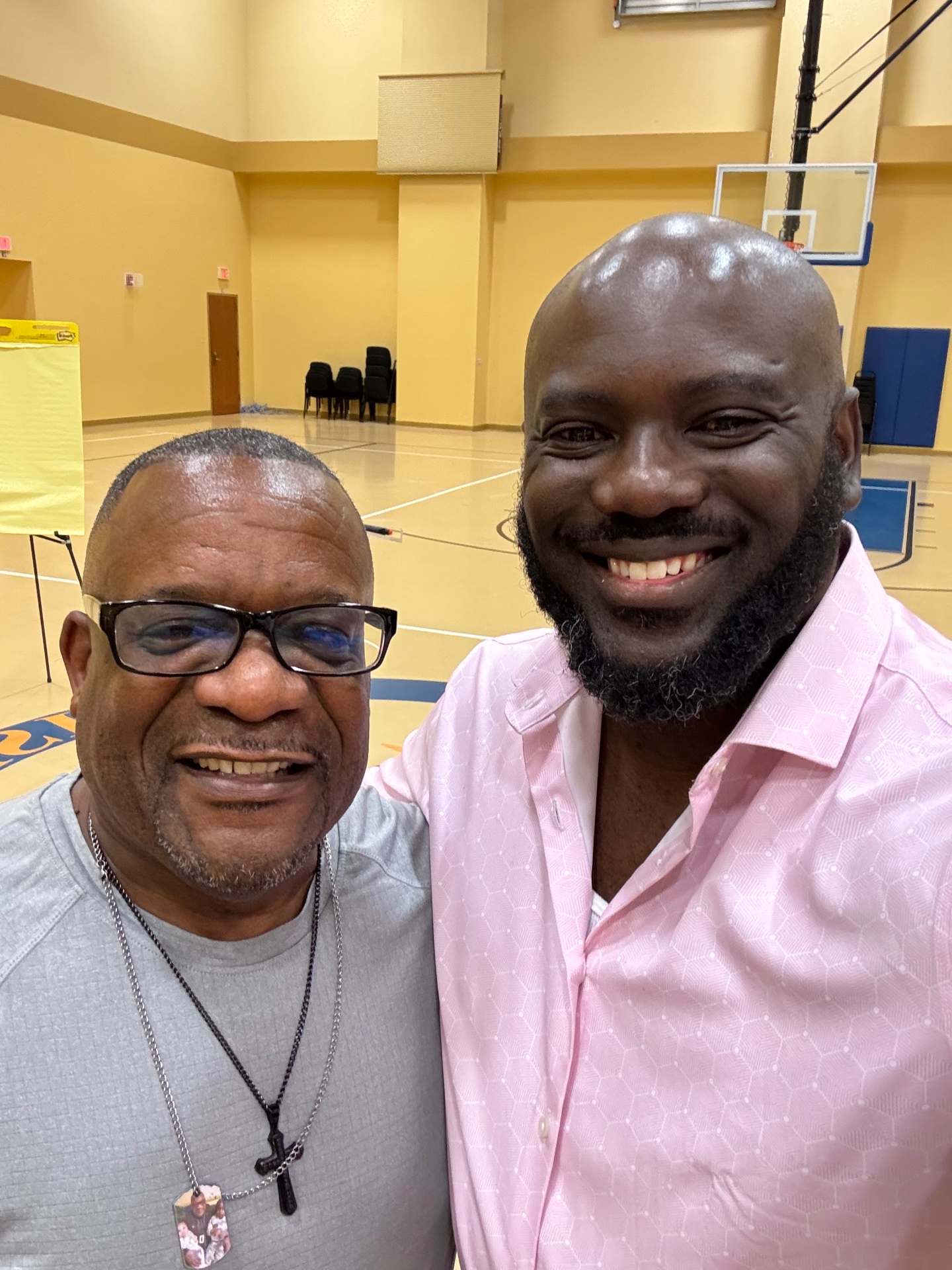 Brown with a community elder after speaking